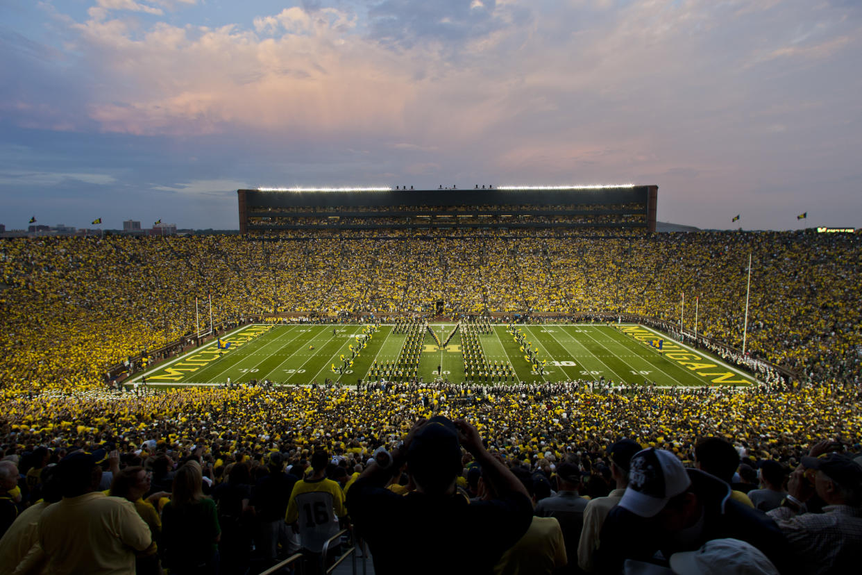 The Michigan Marching Band performs before an NCAA college football game with Notre Dame at Michigan Stadium, in Ann Arbor, Mich., Saturday, Sept. 7, 2013. This is only the second ever night game played at Michigan Stadium. Michigan won 41-30. (AP Photo/Tony Ding)
