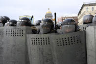 Police stand blocking approaches to the street during a protest against the jailing of opposition leader Alexei Navalny in St. Petersburg, Russia, Sunday, Jan. 31, 2021. Thousands of people have taken to the streets across Russia to demand the release of jailed opposition leader Alexei Navalny, keeping up the wave of nationwide protests that have rattled the Kremlin. Hundreds have been detained by police. (AP Photo/Valentin Egorshin)