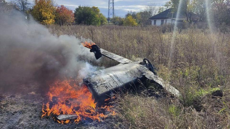 Fragments of a Russian rocket that was shot down by a Ukrainian air defense system burn in the village of Kipti in Ukraine's Chernihiv region on Oct. 19, 2022. (Ukrainian Defence Ministry Press Service via AP)