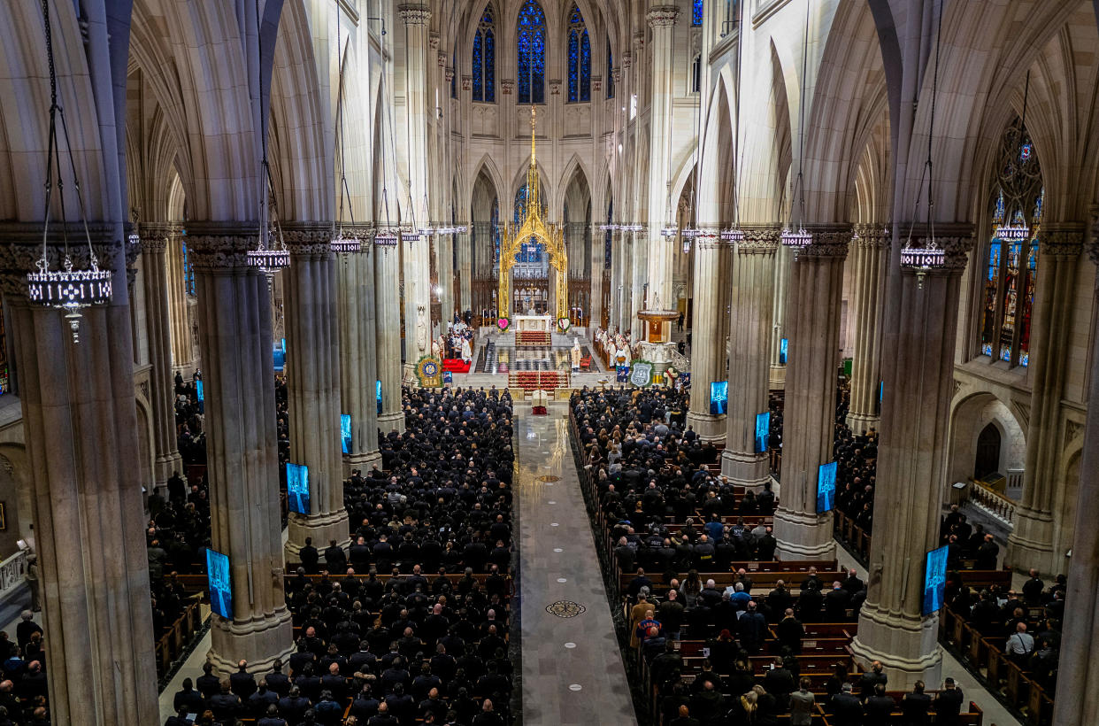 Image: Slain NYPD officer Wilbert Mora is memorialized during a funeral service at St. Patrick's Cathedral in New York on Feb. 2, 2022. (Craig Ruttle / Pool via Reuters)