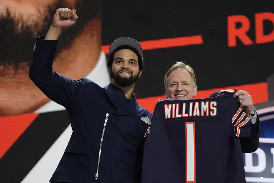 Quarterback Caleb Williams celebrates with NFL commissioner Roger Goodell after being chosen by the Chicago Bears with the first overall pick of the NFL Draft. (AP Photo/Jeff Roberson)