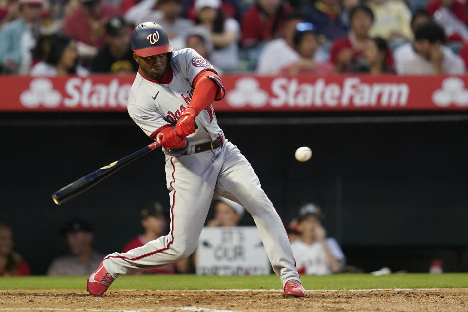 Washington Nationals' Victor Robles (16) pops out to first baseman during the fourth inning of a baseball game against the Los Angeles Angels in Anaheim, Calif., Friday, May 6, 2022. (AP Photo/Ashley Landis)