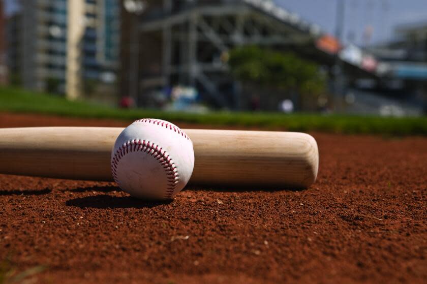 Baseball and bat on a ball field