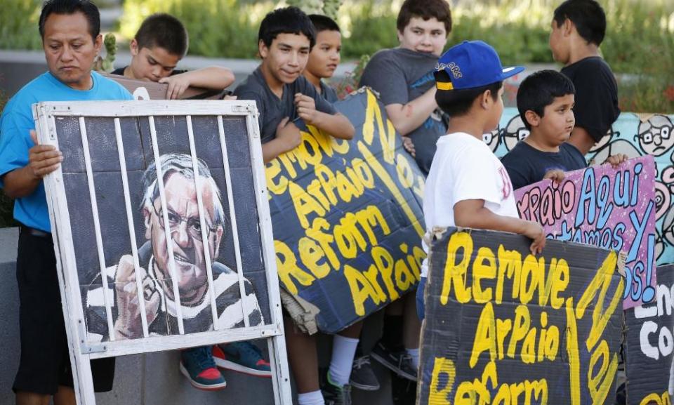 People protest against former sheriff Joe Arpaio in front of the Maricopa county sheriff’s office in Phoenix, 25 May 2016.