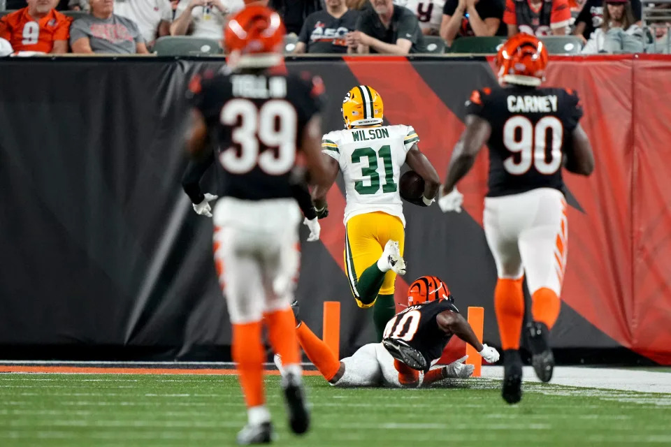 Green Bay Packers running back Emanuel Wilson (31) scores a touchdown in the fourth quarter during a Week 1 NFL preseason game between the Green Bay Packers and the <a class="link " href="https://sports.yahoo.com/nfl/teams/cincinnati/" data-i13n="sec:content-canvas;subsec:anchor_text;elm:context_link" data-ylk="slk:Cincinnati Bengals;sec:content-canvas;subsec:anchor_text;elm:context_link;itc:0"&gtCincinnati Bengals</a>, Friday, Aug. 11, 2023, at Paycor Stadium in Cincinnati.