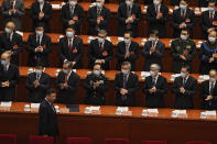 Delegates wearing face masks to help curb the spread of the coronavirus applaud as Chinese President Xi Jinping arrives for the opening session of Chinese People's Political Consultative Conference (CPPCC) at the Great Hall of the People in Beijing, Thursday, March 4, 2021. (AP Photo/Andy Wong)