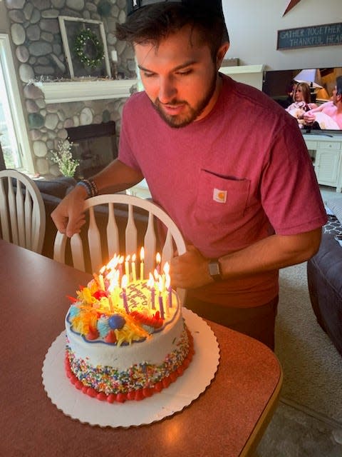 Brady Hessbrook celebrates a birthday with cake.