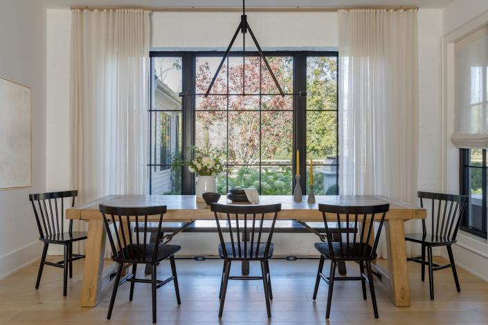 Ample seating for gathering and conversation is a common element seen in farmhouse dining rooms.