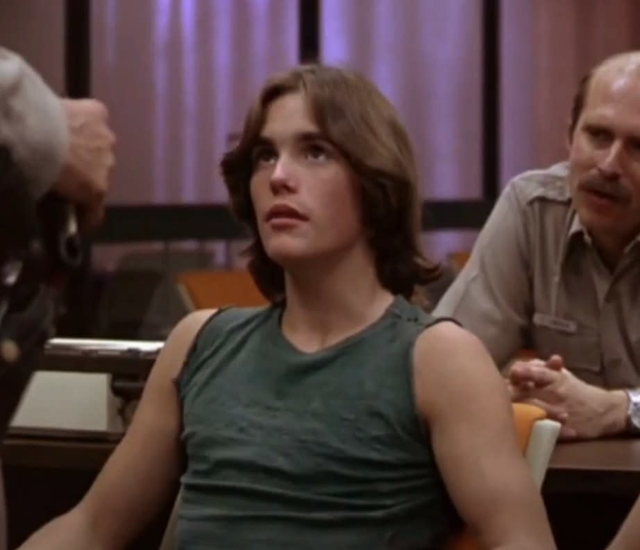 Matt Dillon as Richie listens to a police officer in "Over the Edge"