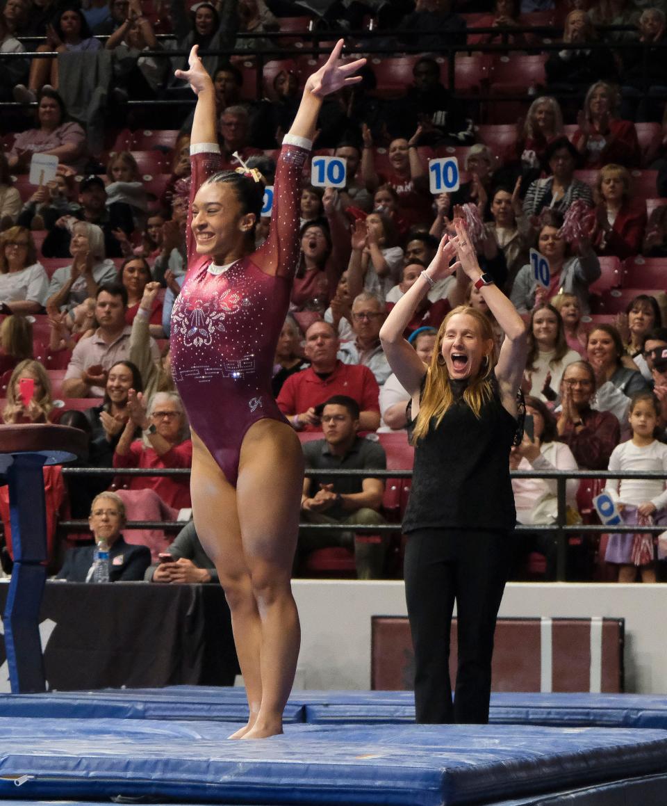 Mar 8, 2024; Tuscaloosa, Alabama, USA; Alabama gymnast Luisa Blanco and Alabama head coach Ashley Johnston celebrate after Blanca’s dismount from the beam during a quad meet with Illinois, Minnesota, and Talladega at Coleman Coliseum.