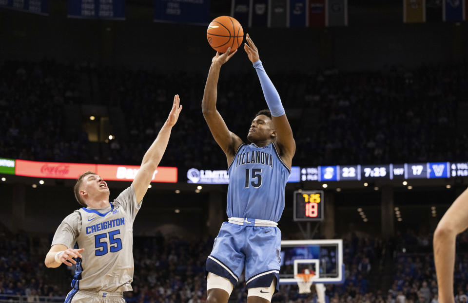 Villanova's Jordan Longino (15) shoots against Creighton's Baylor Scheierman (55) during the first half of an NCAA college basketball game Wednesday, Dec. 20, 2023, in Omaha, Neb. (AP Photo/Rebecca S. Gratz)