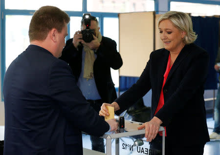 Marine Le Pen, French National Front (FN) political party candidate for French 2017 presidential election, casts her ballot in the second round of 2017 French presidential election at a polling station in Henin-Beaumont, France, May 7, 2017. REUTERS/Pascal Rossignol