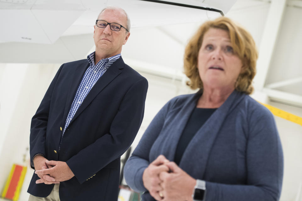 Heitkamp and Rep. Kevin Cramer, R-N.D., attend an event with National Guardsmen in Bismarck, N.D., in August. (Photo: Tom Williams/CQ Roll Call)