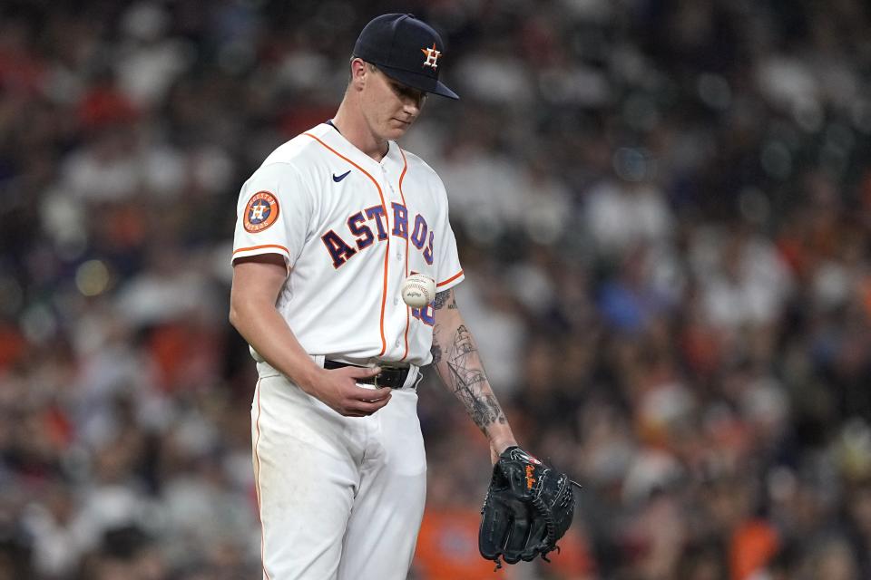 Houston Astros starting pitcher Hunter Brown waits for manager Dusty Baker Jr. to make his way to the mound before being pulled during the fifth inning of a baseball game against the Minnesota Twins Wednesday, May 31, 2023, in Houston. (AP Photo/David J. Phillip)