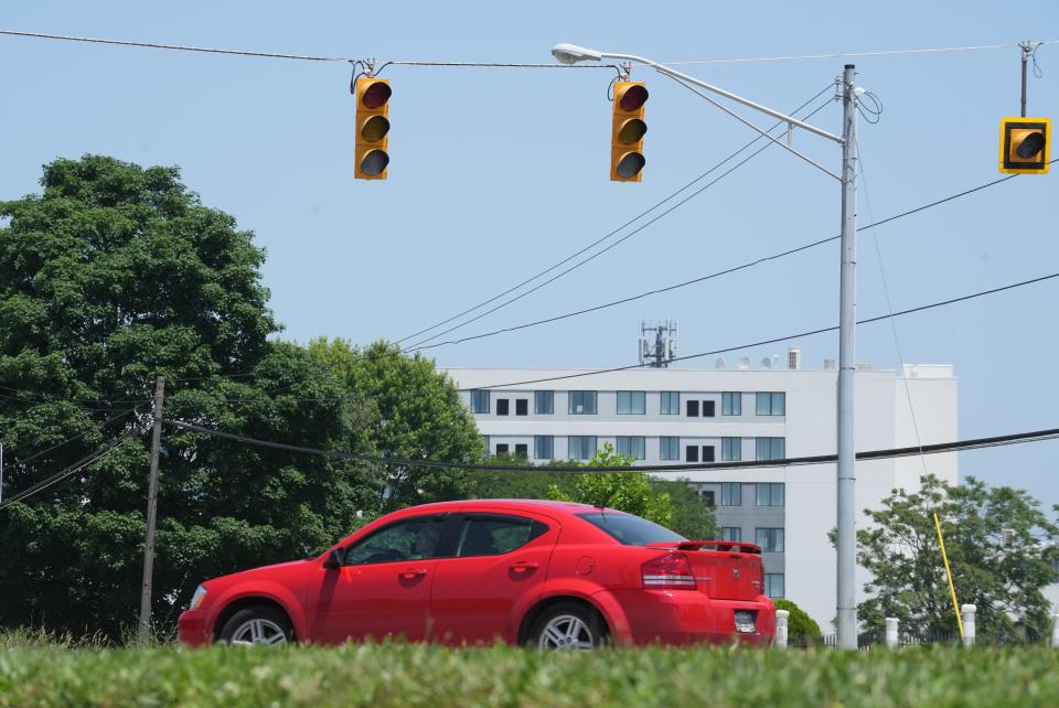 A car turns left to Harley Drive from Olentangy River Road during an electric outage Thursday causing traffic lights not to work.