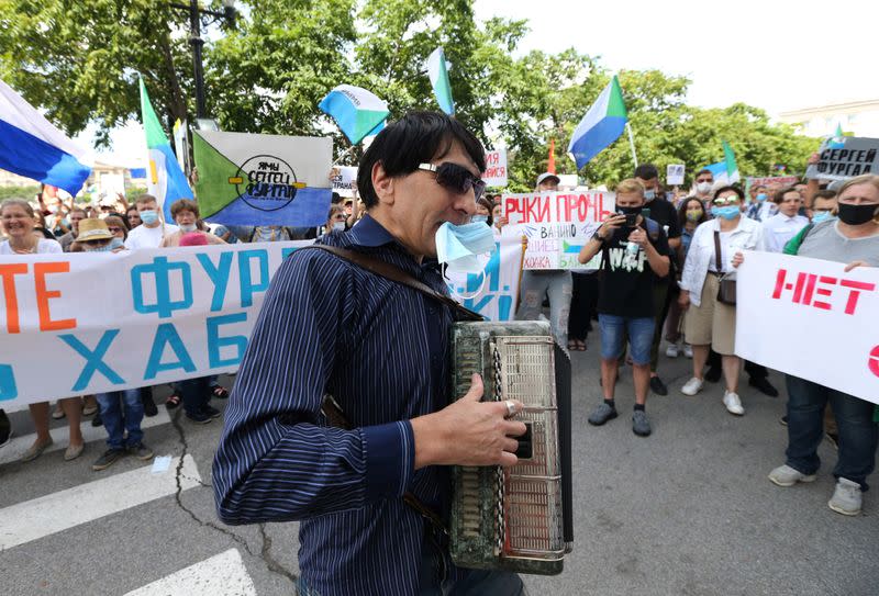 A man plays the accordion during a rally in support of former regional governor Sergei Furgal in Khabarovsk