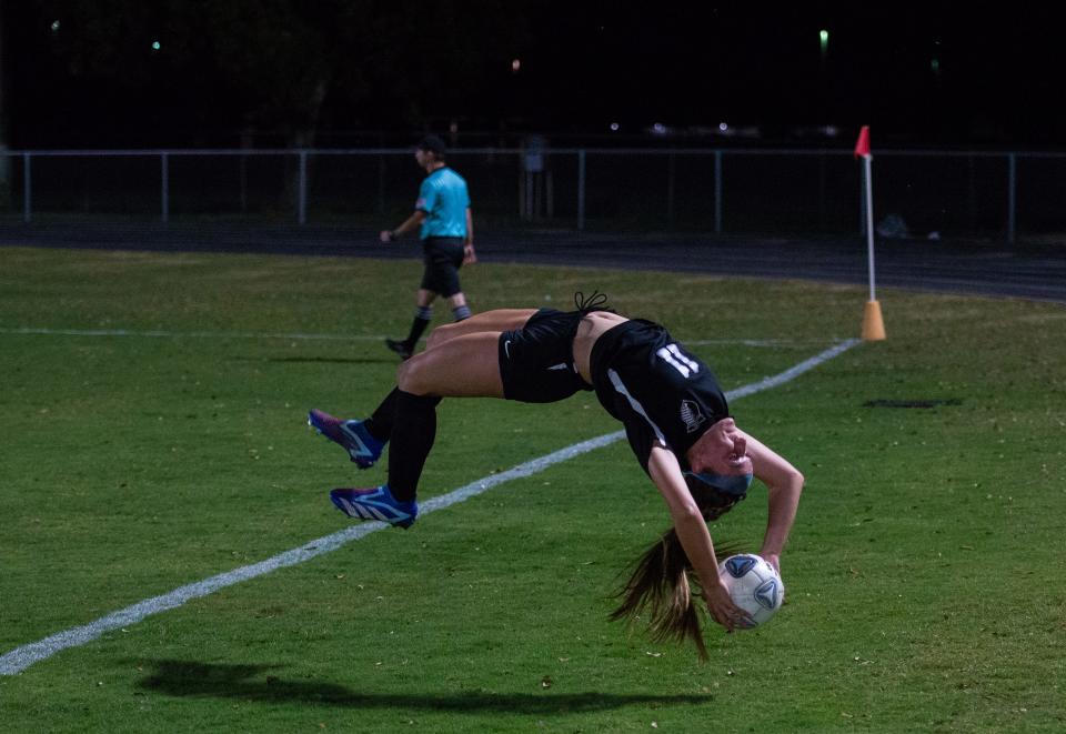 Mariner's Kelsi Longabardi does a flip throw in during Friday's Region 5A-3 semifinal against Naples.