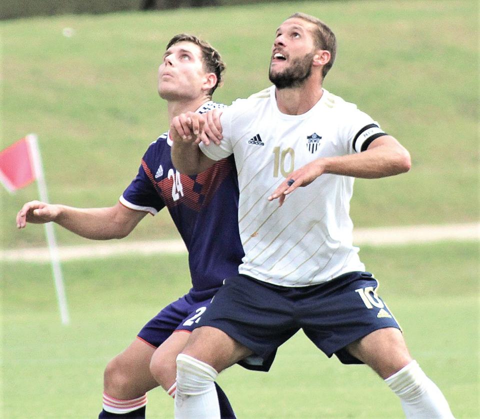 Oklahoma Wesleyan University's Stefan Lukic, right, scraps with an opposing player in soccer action earlier this season. In the No. 1 vs. No. 2 match later in the campaign, Lukic tallied OKWU's only goal in the 2-1 loss at Central Methodist (Mo.). Lukic also scored for OKWU in a 2-1 loss in Thursday's NAIA national tourney quarterfinals that ended the season and his college soccer career.