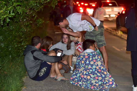 People outside their houses are seen along a street after an earthquake in Coquimbo, Chile January 19, 2019. Picture taken January 19, 2019. REUTERS/Alejandro Pizarro