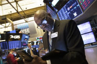 John Wilson, with the New York Stock Exchange, monitors stock activity, Monday, Sept. 16, 2019. Global stock markets sank Monday after crude prices surged following an attack on Saudi Arabia's biggest oil processing facility. (AP Photo/Mark Lennihan)