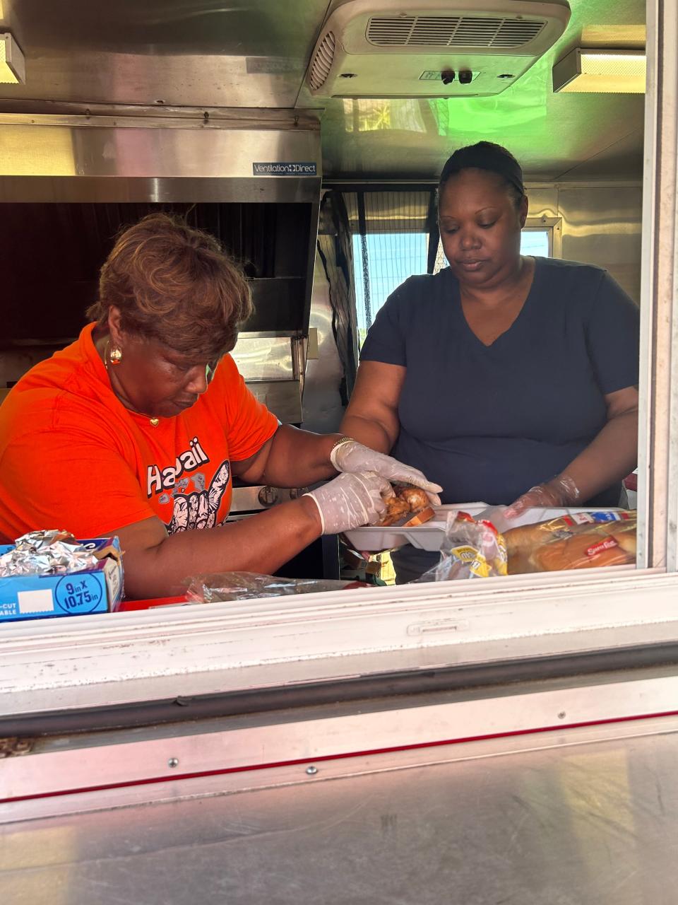 New Birth Tabernacle of Praise congregation members and Peter's Sons BBQ helping to serve southside Tallahassee residents on Saturday, May 11.