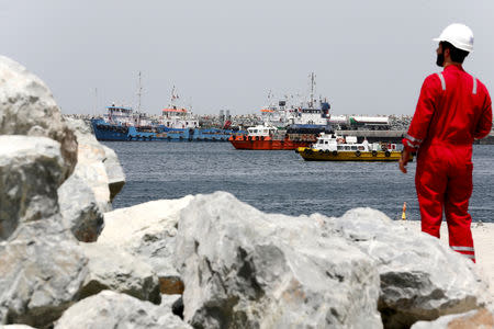 FILE PHOTO: A technical staff is seen at the Port of Fujairah, United Arab Emirates, May 13, 2019. REUTERS/Satish Kumar -/File Photo