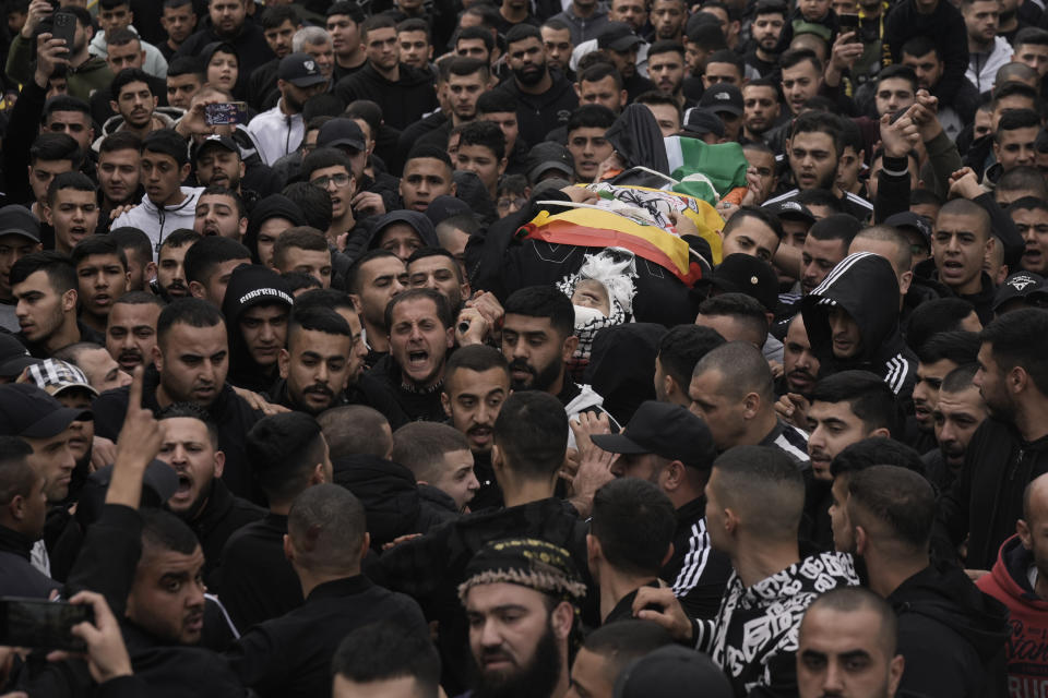 Palestinians attend the funeral of Mohammed Sherif Hassan Selmi in Qalqiliya, West Bank, Tuesday, Feb. 13, 2024. The Israeli army said that Salemi was shot and killed when he tried to overrun soldiers. (AP Photo/Majdi Mohammed)