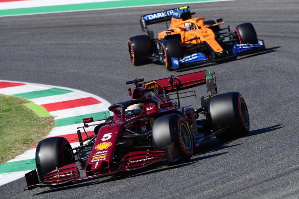 Sebastian Vettel in the deep burgundy Ferrari