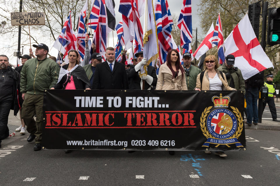 Britain First leaders Jayda Fransen (2R) and Paul Golding (3L) lead March Against Terrorism on April 01, 2017 in London, England.