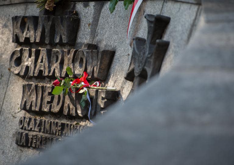 File picture shows flowers and candles on a memorial dedicated to the victims of communism, in Katowice, Poland