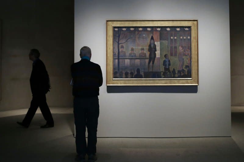 A man stops to look at Georges Seurat's "Circus Sideshow" at The Metropolitan Museum of Art on February 21, 2020. The museum opened February 20, 1872. File Photo by John Angelillo/UPI