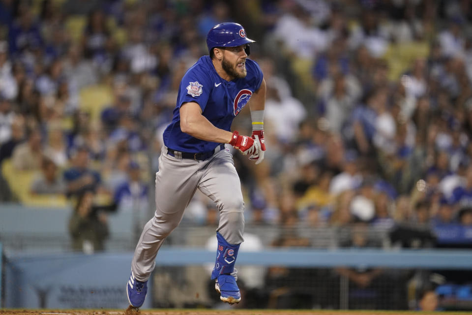 Chicago Cubs' Patrick Wisdom (16) runs to first on a single during the fourth inning of a baseball game against the Los Angeles Dodgers in Los Angeles, Friday, July 8, 2022. (AP Photo/Ashley Landis)