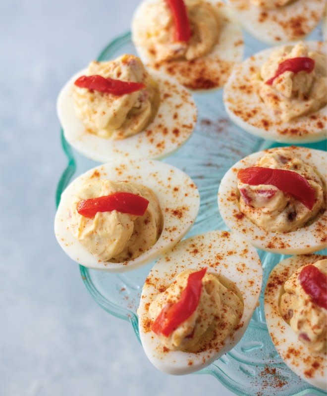 <p>Parrish Ritchie</p><p>This twist on deviled eggs smartly trims prep time with an assist from prepared pimento cheese spread. Crank up the flavors with a squeeze of lemon juice or a sprinkle of cayenne pepper before serving.</p><p><strong>Get the recipe: <a href="https://parade.com/1214989/parade/easy-pimento-cheese-deviled-eggs/" rel="nofollow noopener" target="_blank" data-ylk="slk:Easy Pimiento Cheese Deviled Eggs;elm:context_link;itc:0;sec:content-canvas" class="link rapid-noclick-resp">Easy Pimiento Cheese Deviled Eggs</a></strong></p>