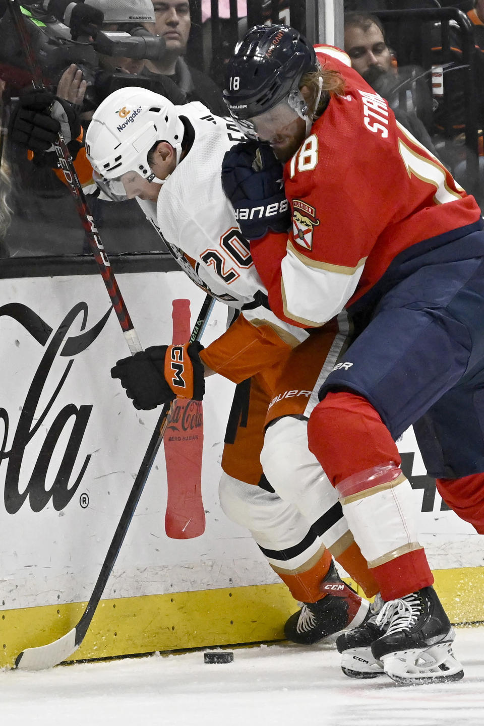 Anaheim Ducks right wing Brett Leason, left, vies for the puck with Florida Panthers defenseman Marc Staal during the first period of an NHL hockey game in Anaheim, Calif., Sunday, Nov. 6, 2022. (AP Photo/Alex Gallardo)