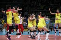 <p>China’s players celebrate winning the match and the gold medal. REUTERS/Ricardo Moraes </p>