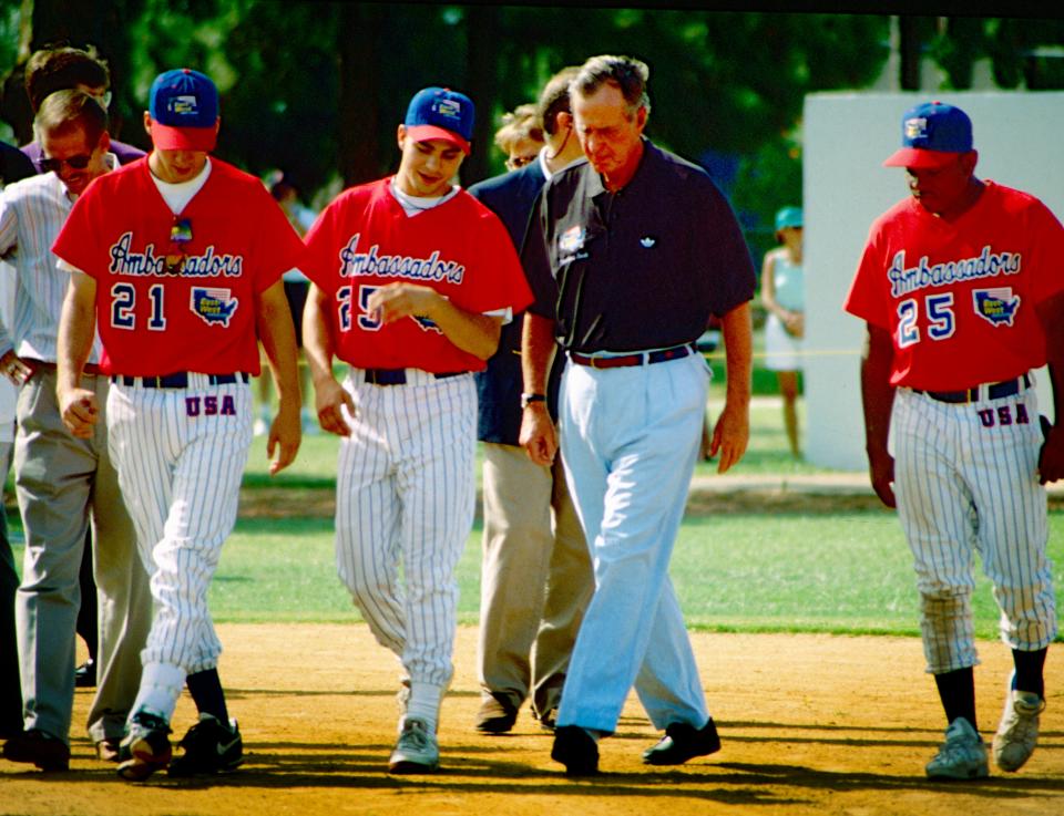 Former President George H. W. Bush talked baseball with some of the East West Ambassador baseball players July 7, 1994, at Dodgertown in Vero Beach. He was there to congratulate the 350 international players for their efforts in carrying American Goodwill abroad. He designated the team as one of his "thousand points of light." The team was a non-profit organization that sent youth baseball teams abroad as goodwill ambassadors.