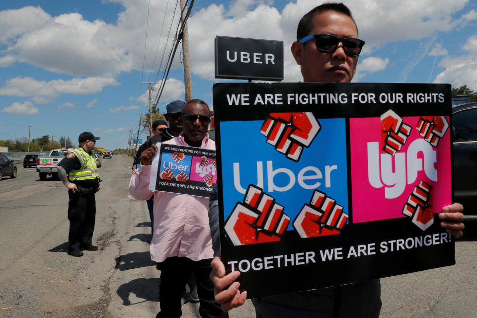 Uber and Lyft drivers protest during a day-long strike outside Uber’s office in Saugus, Massachusetts, U.S., May 8, 2019.   REUTERS/Brian Snyder