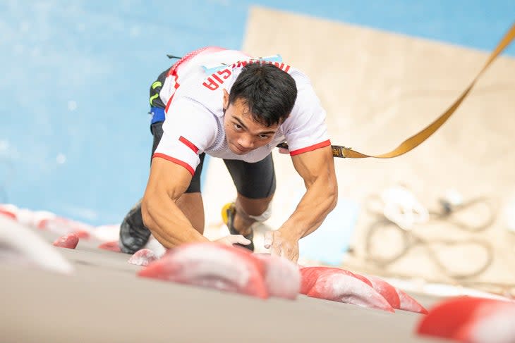 Speed climber Kiromal Katabin of Indonesia competing in a speed world cup.