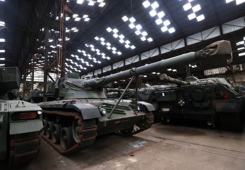 Dozens of German-made Leopard 1 tanks are seen in an hangar in Tournais