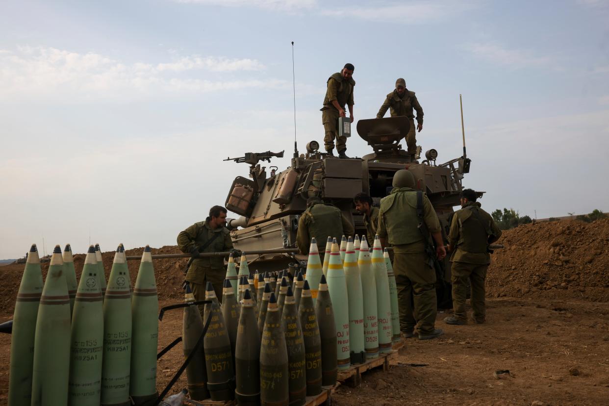 Israeli soldiers take position near the Israeli Gaza border, southern Israel (Copyright 2023 The Associated Press All rights reserved)