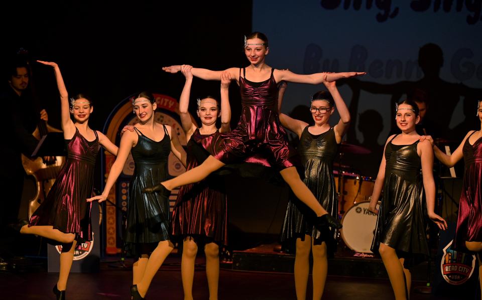 Dancers from Go! Contemporary Dance Company kick up their heels in a Charleston to the sounds of the Read City Band from the UT Jazz Department.