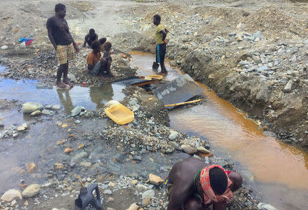 A supplied image shows locals searching for gold in the Jaba River near the former Bougainville Copper Limited's (BCL) Panguna mining operation located on the Pacific Ocean island of Bougainville, Papua New Guinea, October 19, 2016. Picture taken October 19, 2016. Renzie Duncan/Handout via REUTERS