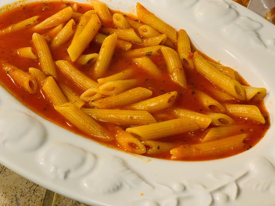 Trader Joe's penne abriatta cooked and served on a white plate