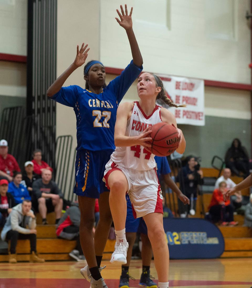 Conrad's Stefanie Kulesza (44) goes up for a shot attempt by being defended by Sussex Central's Brenya Reid (22) in their game at Conrad Schools of Science.