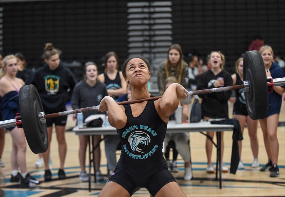 Amaya Robinson-Black, of Jensen Beach High School, works to successfully lift 130 pounds in the clean and jerk competition during the Girls Weight Lifting Class 2A District 16 meet on Friday, Jan. 21, 2022, at Jensen Beach High School. 
