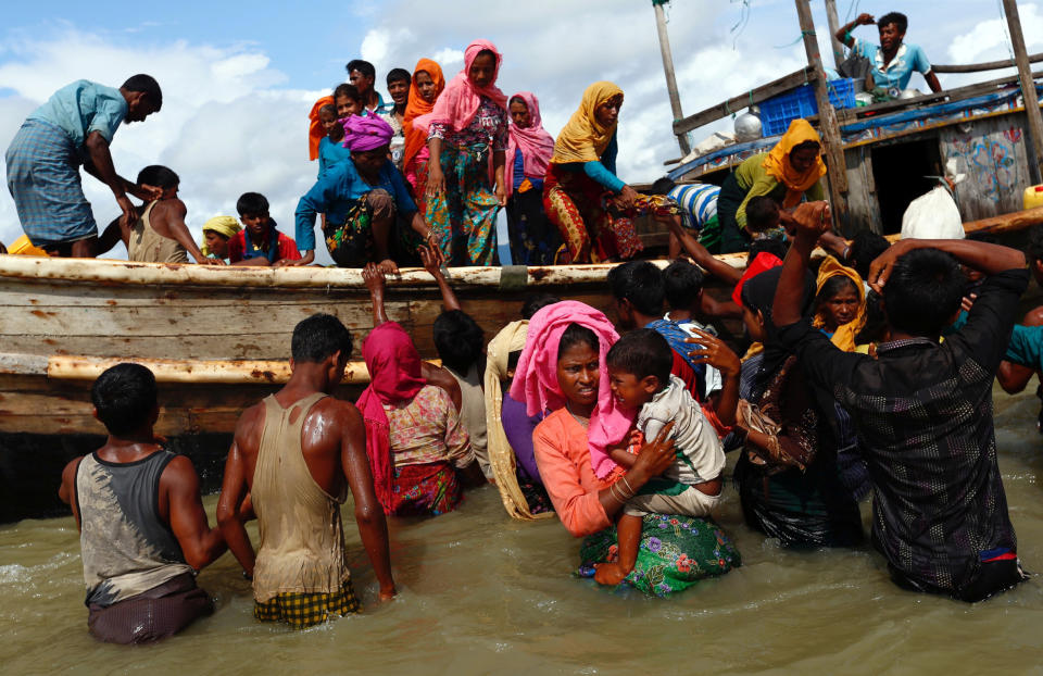 Rohingya refugees get off a boat after crossing the Bangladesh-Myanmar border through the Bay of Bengal on Sept. 11. (Photo: Danish Siddiqui/Reuters)
