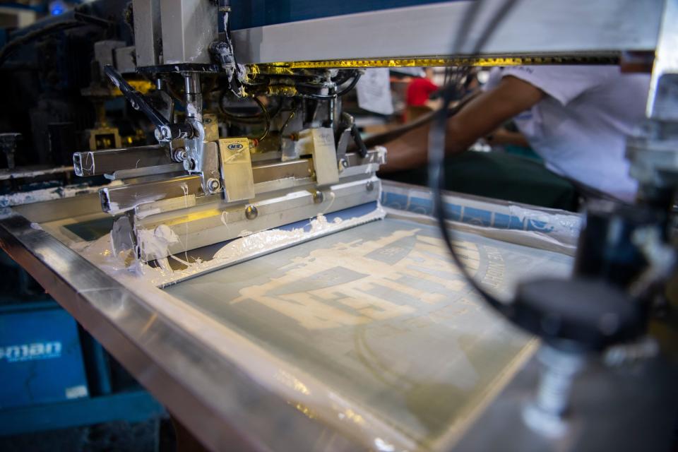 Morgan Wallen’s green hoodie being printed at the Something Inked warehouse in Nashville.