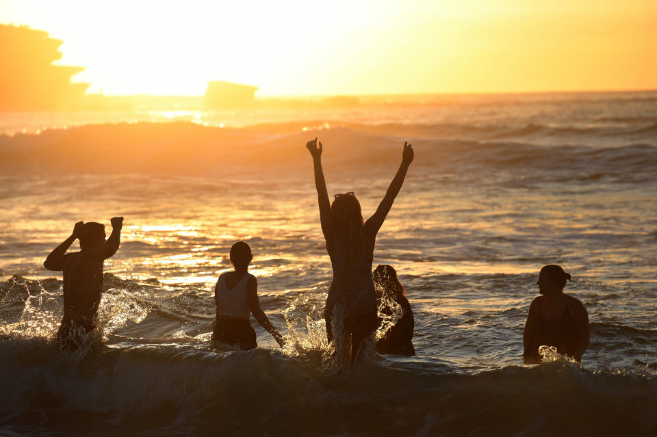 Revellers frolic in the water at dawn at Bondi Beach. Source: AAP