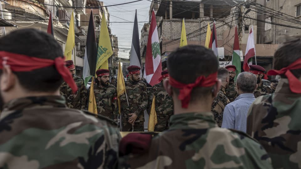 Hezbollah supporters in military formation moments before the funeral of a militant killed while clashing with Israeli forces last month in southern Lebanon. - Manu Brabo/Getty Images