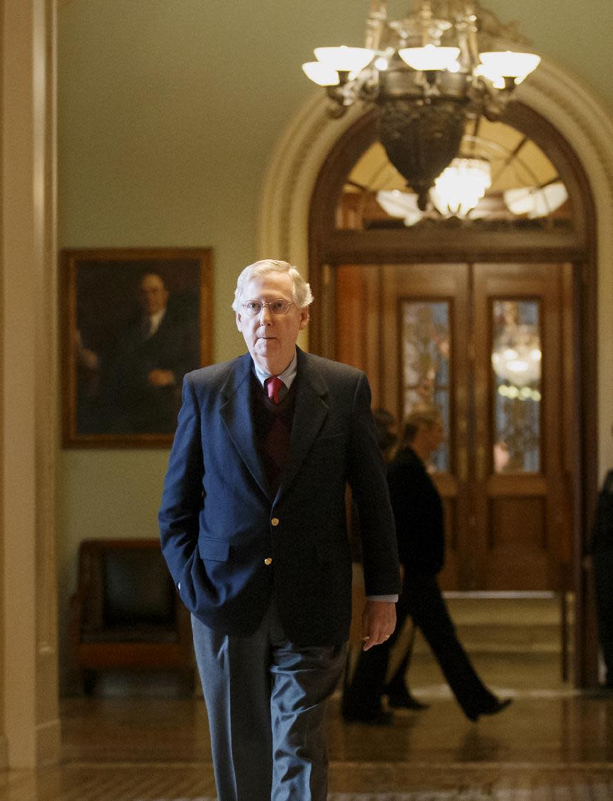 Senate Minority Leader Mitch McConnell of Ky. returns to his Capitol Hill office in Washington, Monday, Feb. 3, 2014, after speaking on the floor as the Farm Bill is considered. (AP Photo/J. Scott Applewhite)